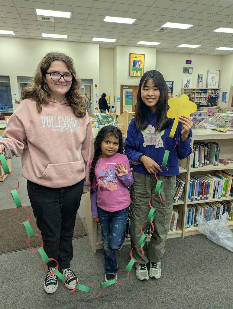 three students with a paper chain