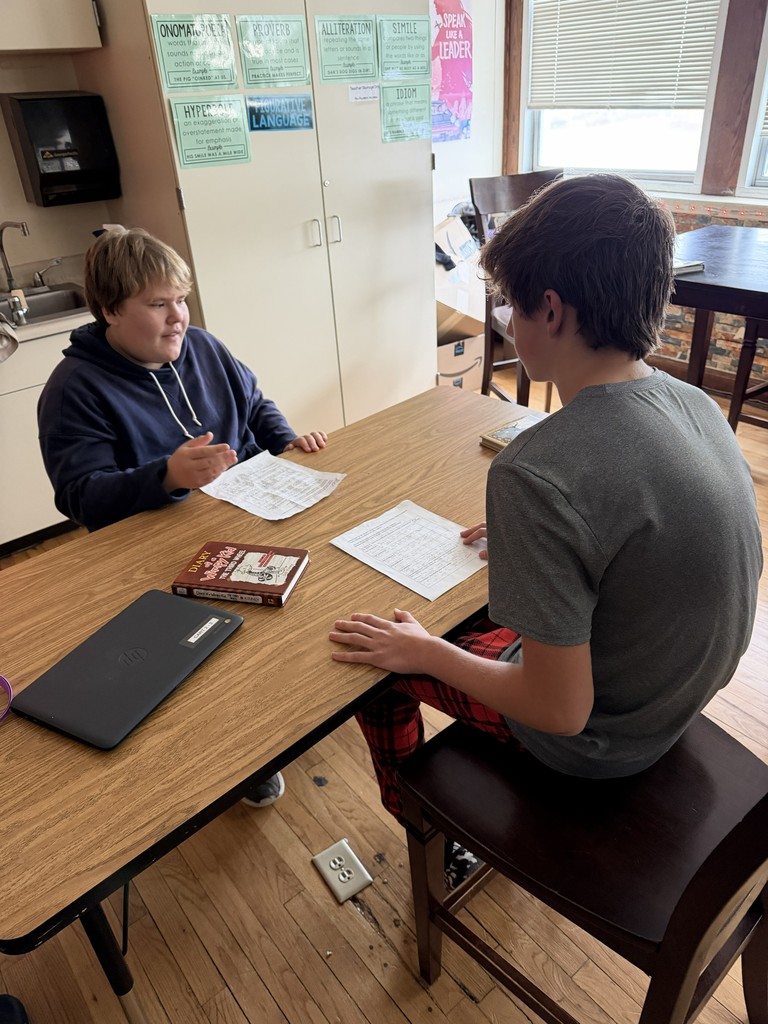 Two students at a desk
