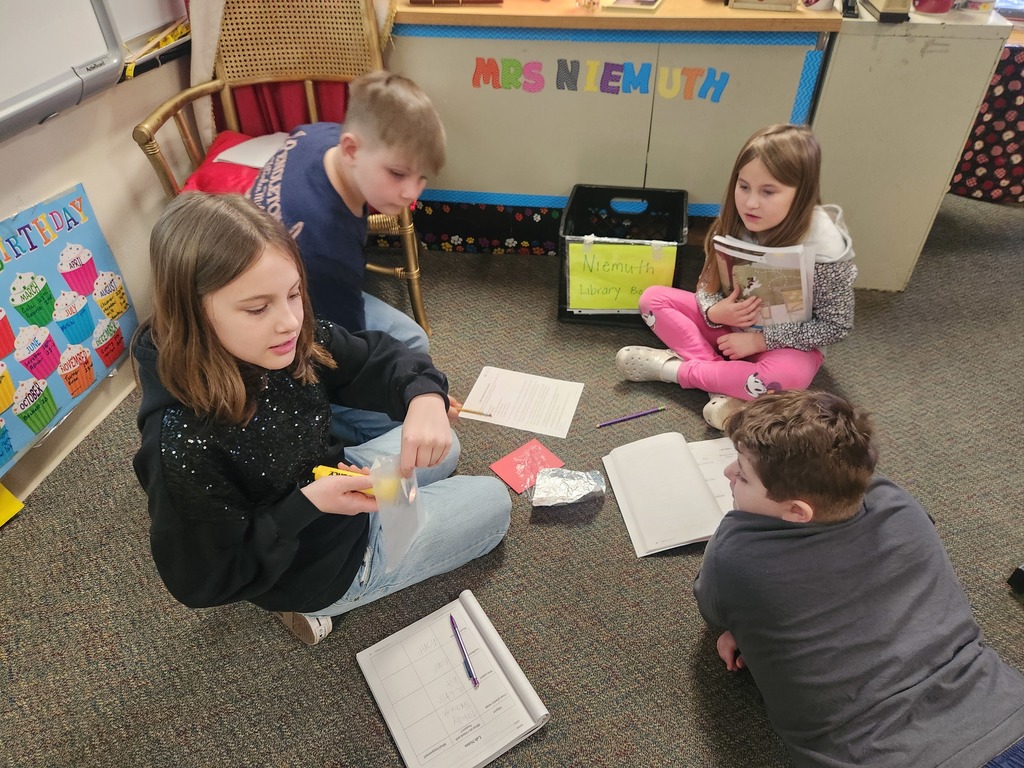 four student doing a light experiment