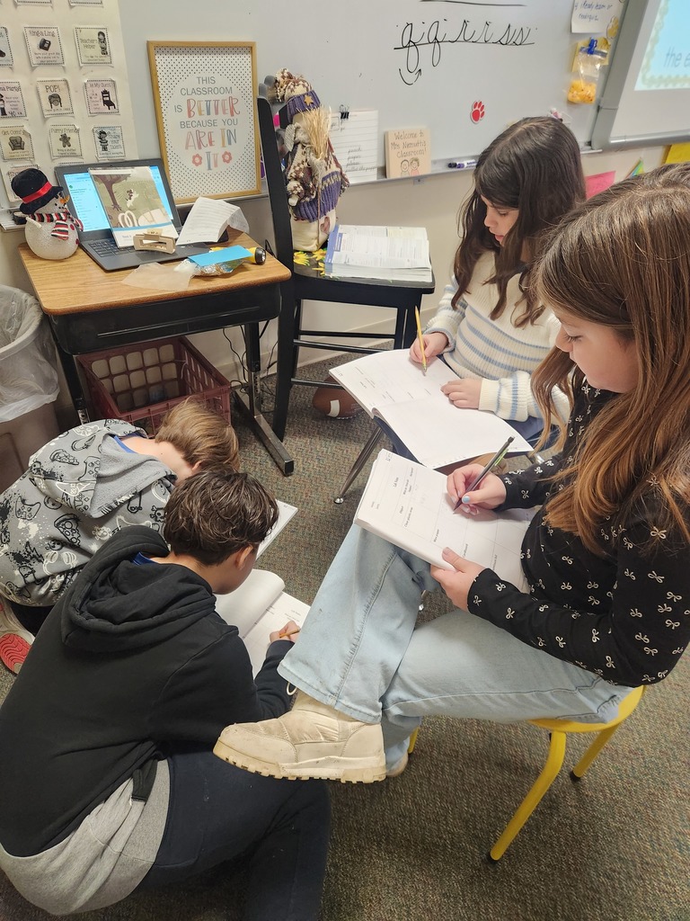 four student doing a light experiment