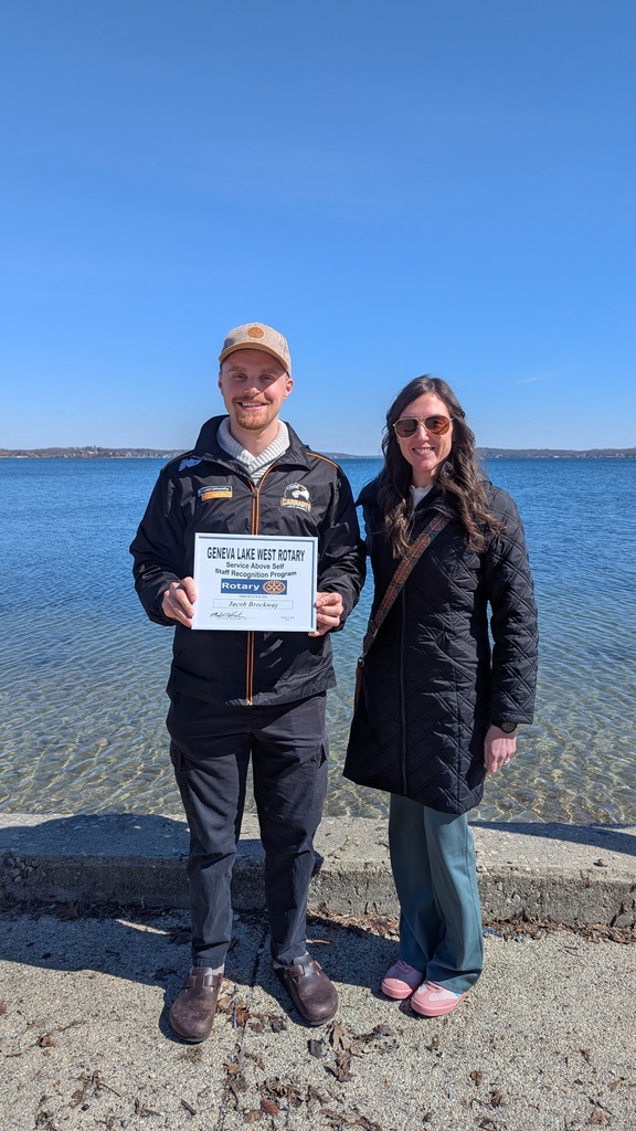 Service Above Self Rotary Award - One male and one female standing in front of the lake. 
