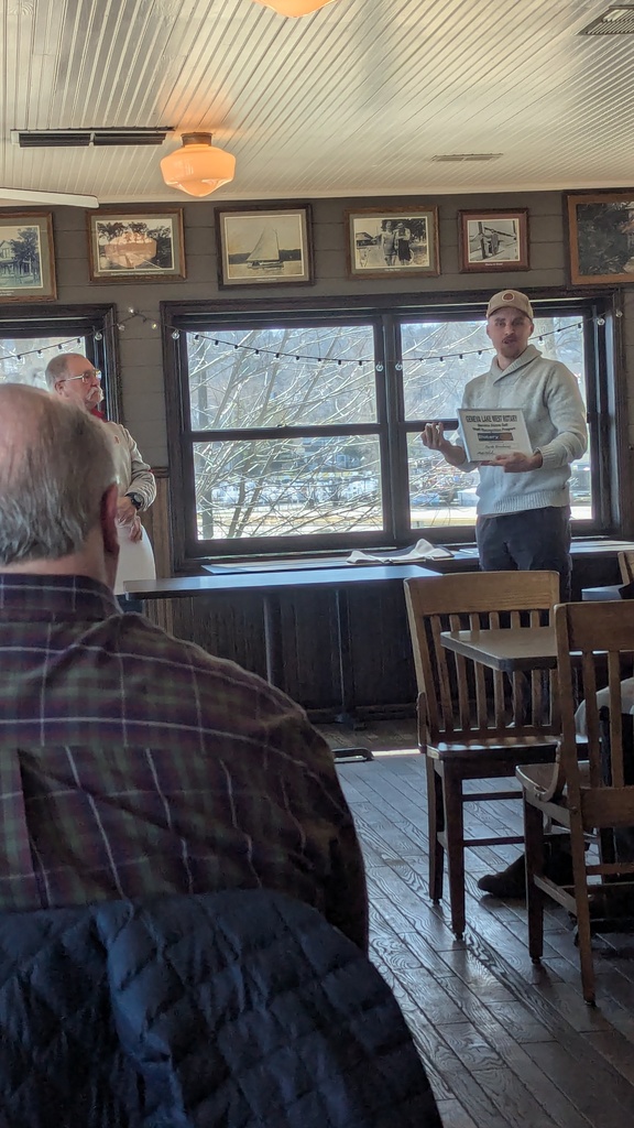Mr. Brockway showing the award. 