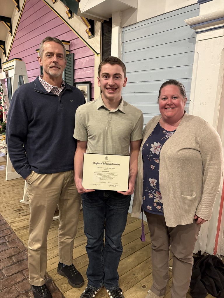 Maddox receiving his DAR award. 