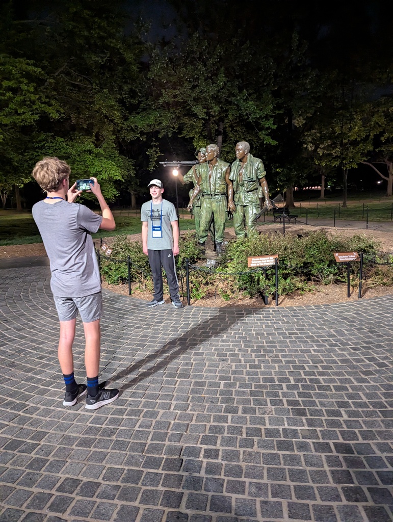 students in front of Monument 