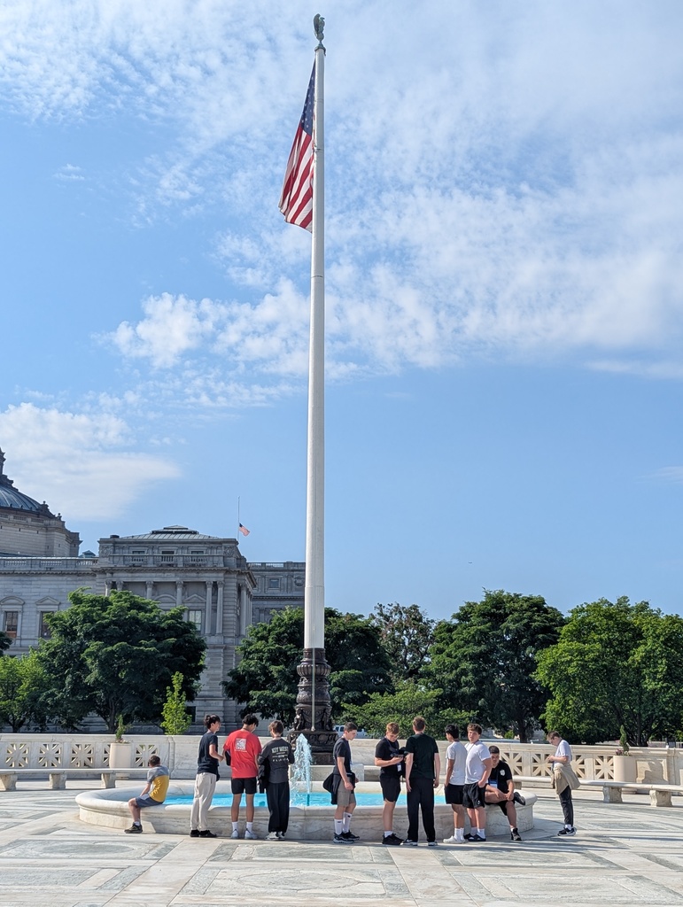 Students by a flag pole in Washington DC
