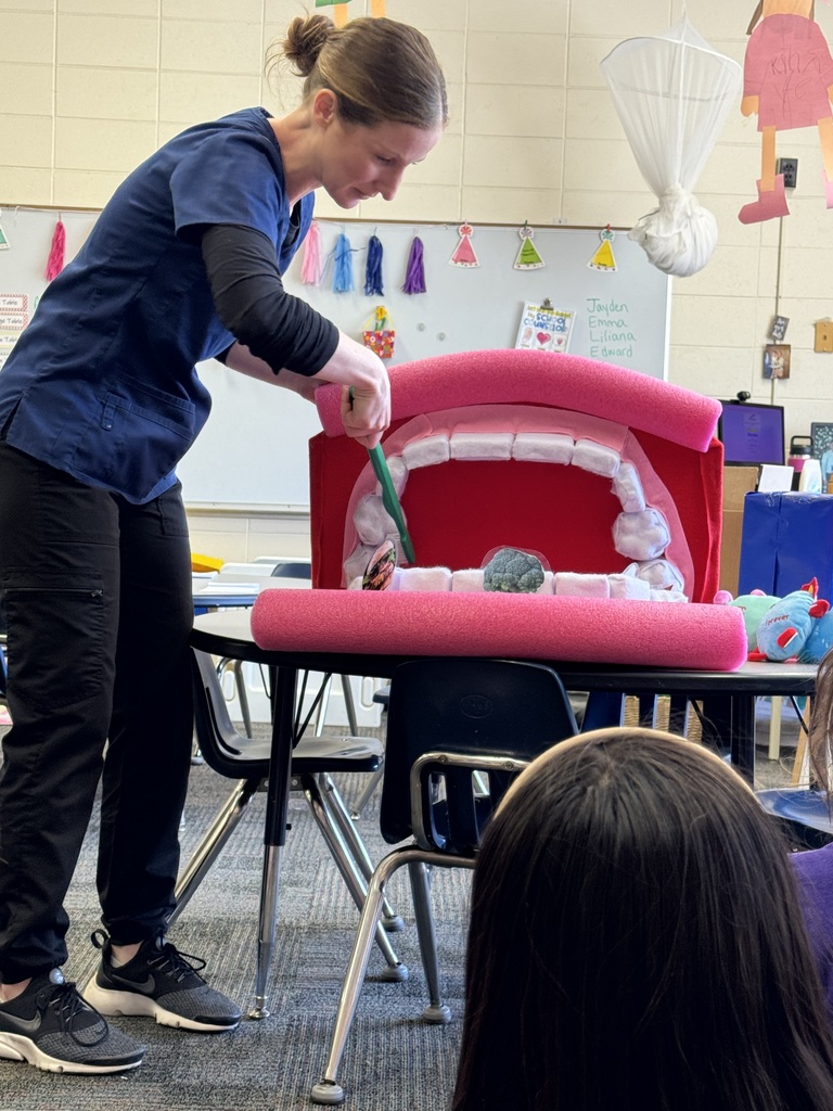 Adult demonstrating teeth brushing with a large mouth and brush.