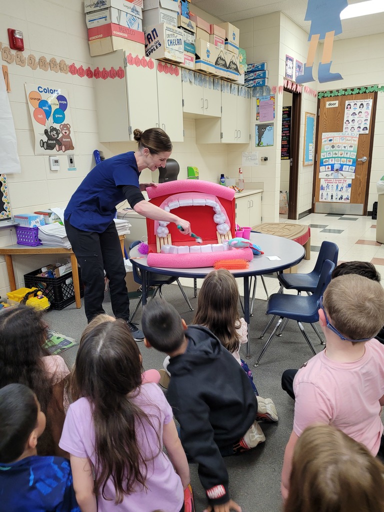 Demonstration on how to brush teeth with large mouth and brush.
