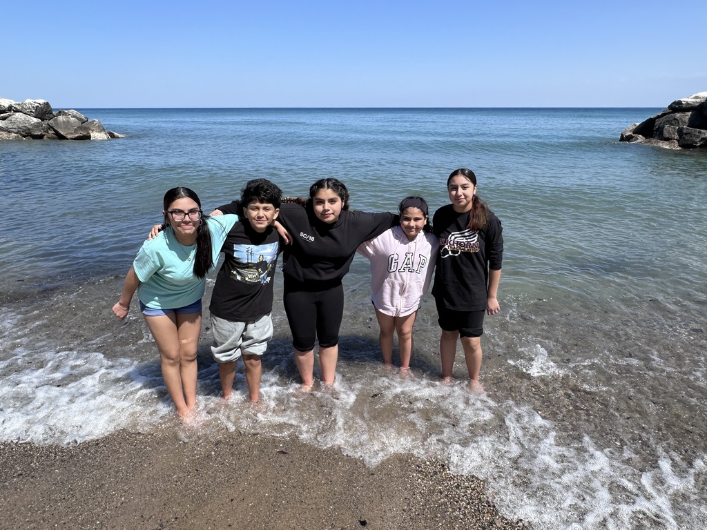 five students in the water