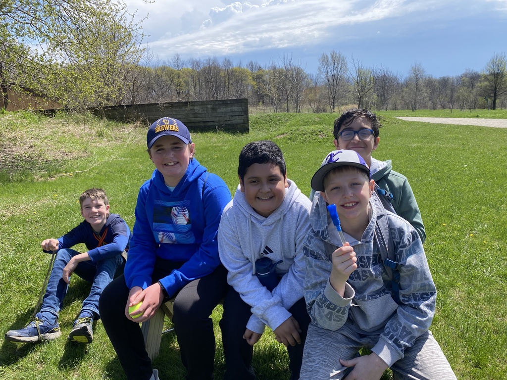 five students on a bench at Havenwood State Forest