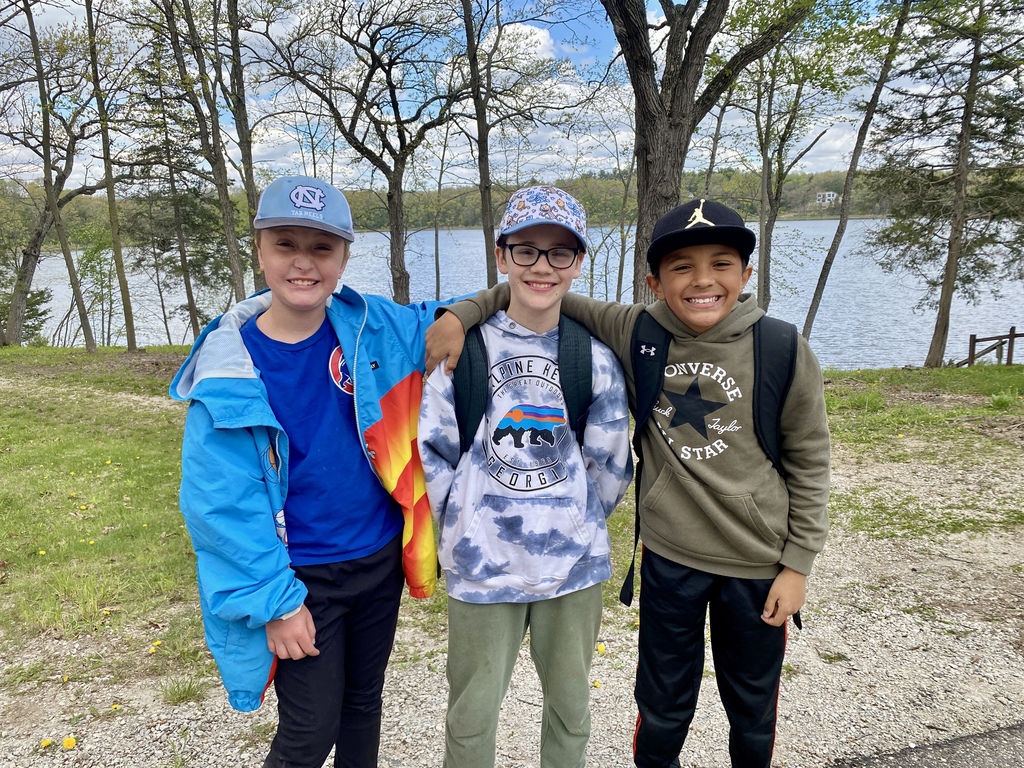 students in front of a lake