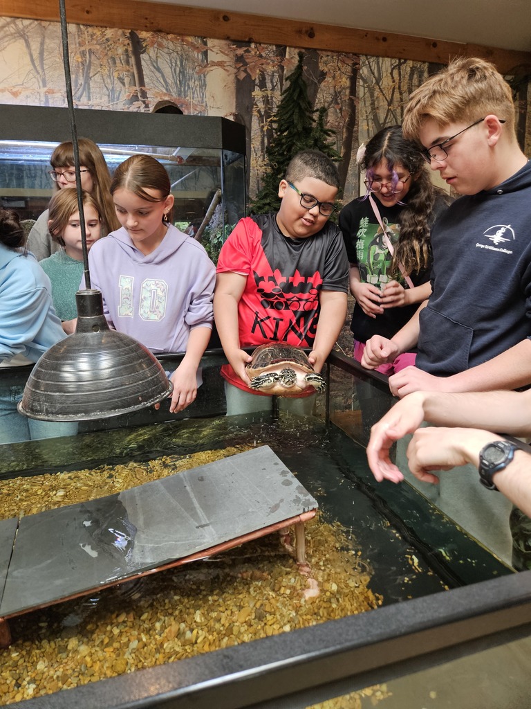 student with a turtle