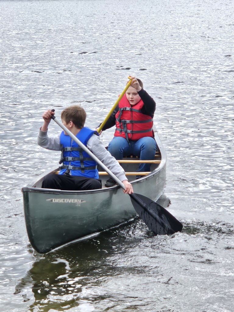 two students canoeing