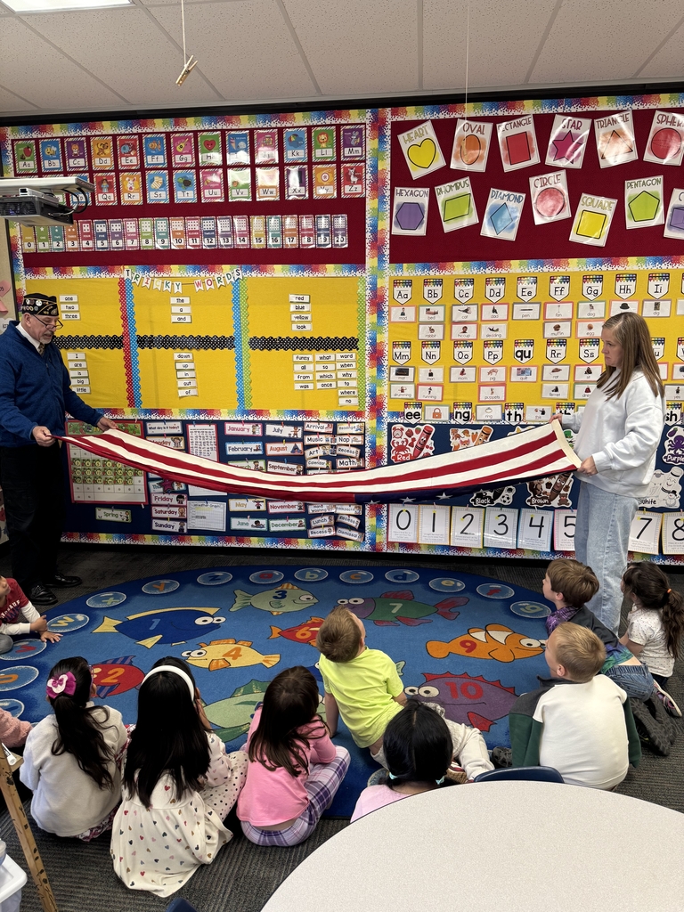 Mr. Kahl demonstrating flag folding for students