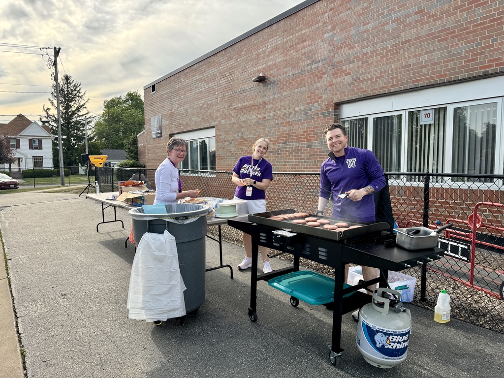 three staff members at the cook out