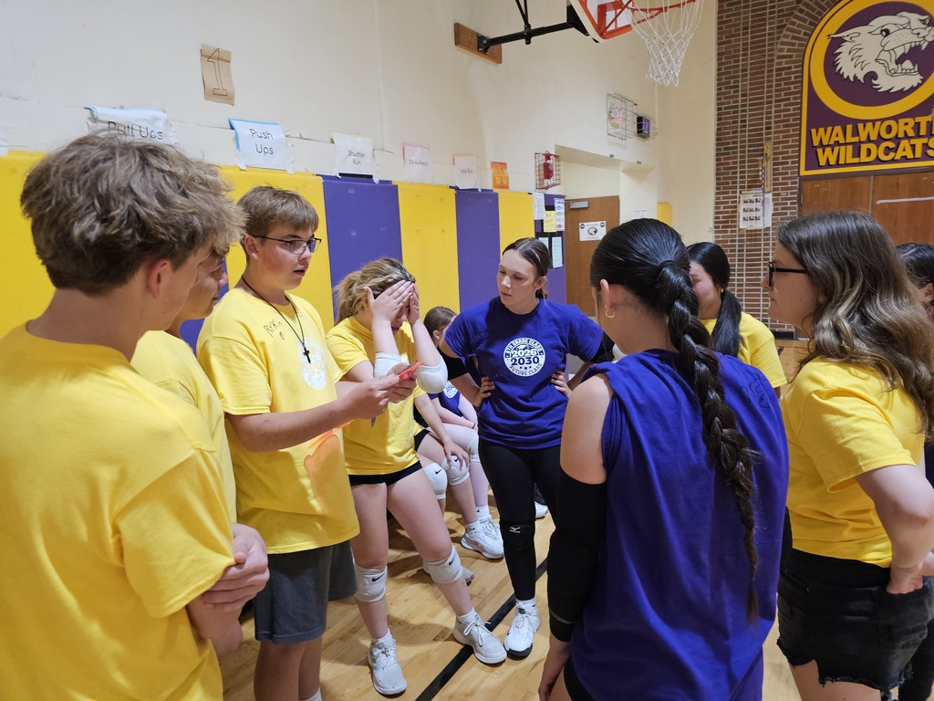 students and staff in the gym