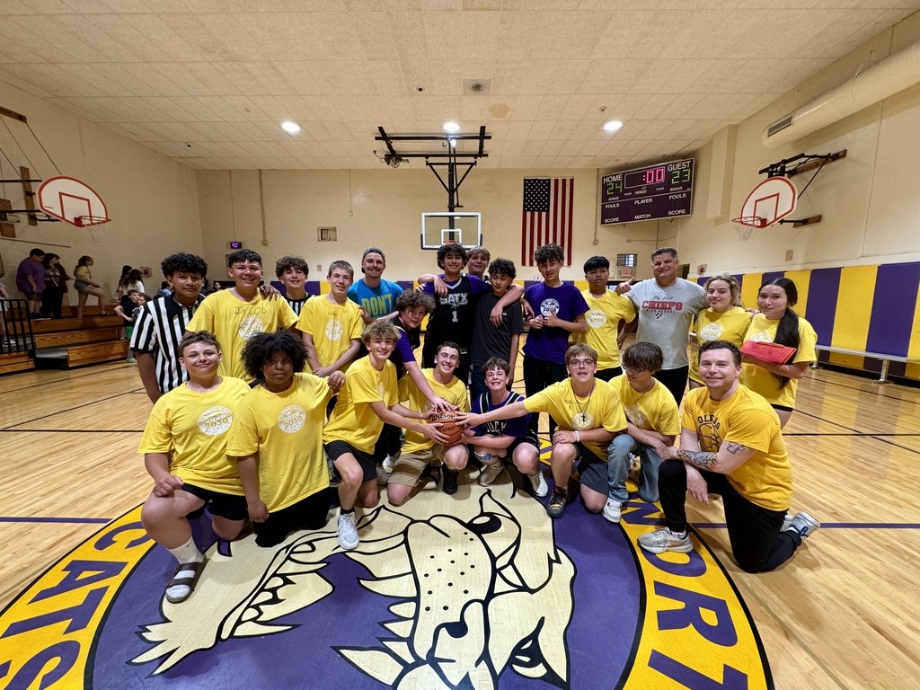 students and staff in the gym