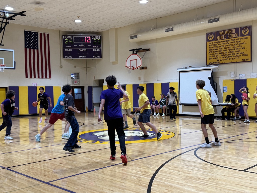 students and staff in the gym 