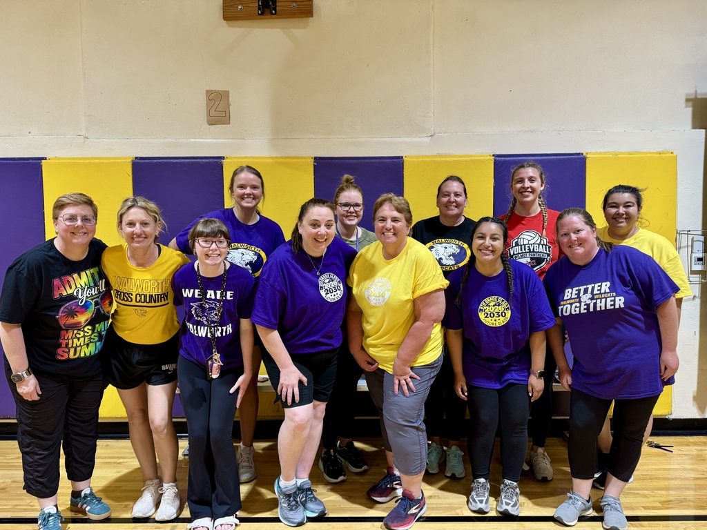 students and staff in the gym
