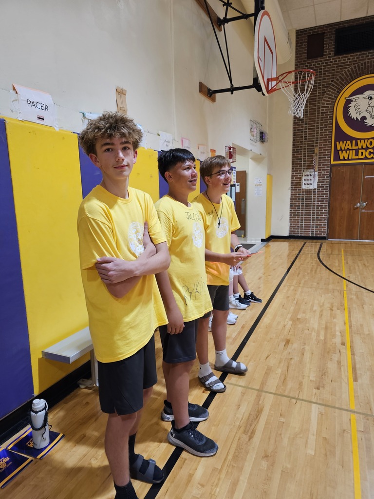 students and staff in the gym