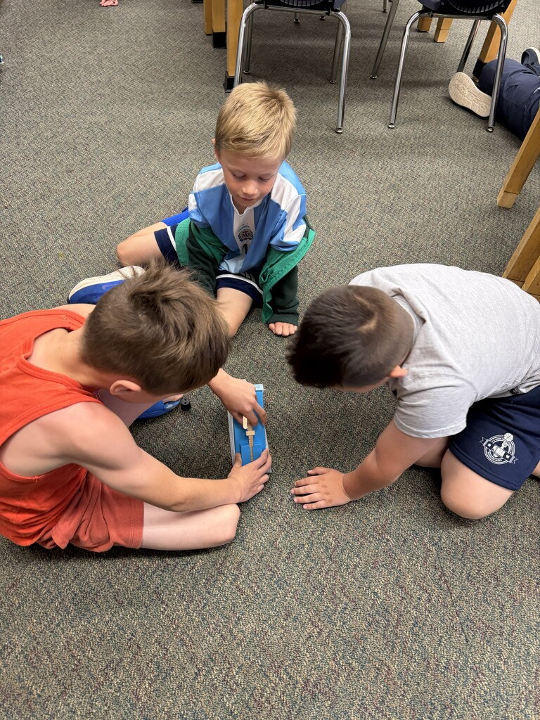 3 students doing an experiemnt