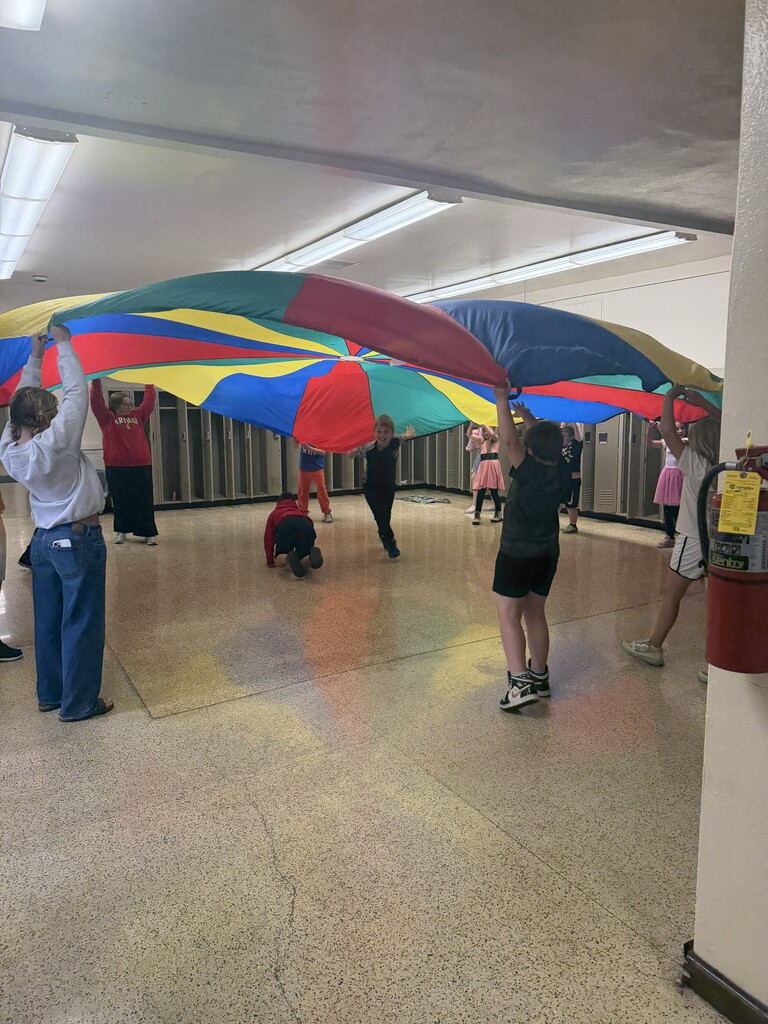 students with large parachute  