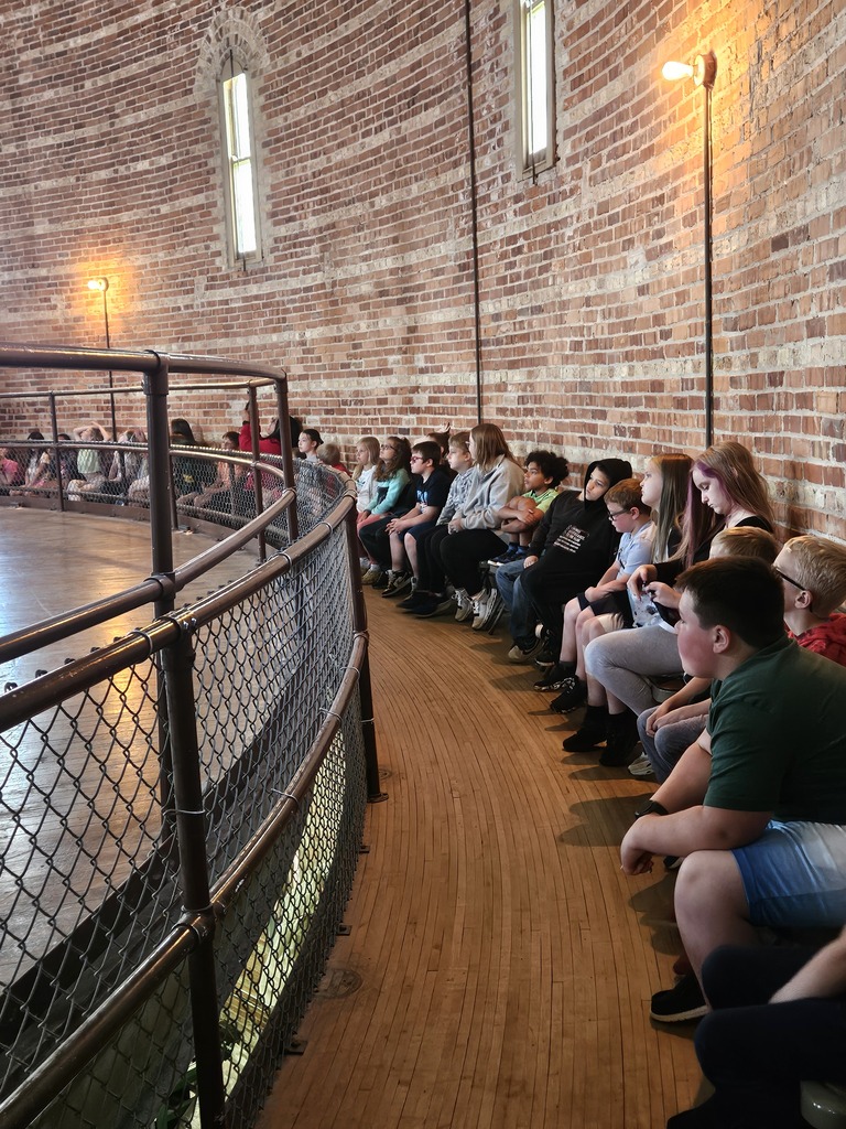 Students listening to a presentation about the telescope at Yerkes Observatory.
