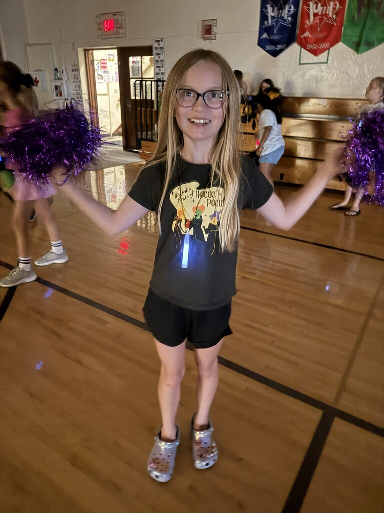 Student with blue glow stick. 