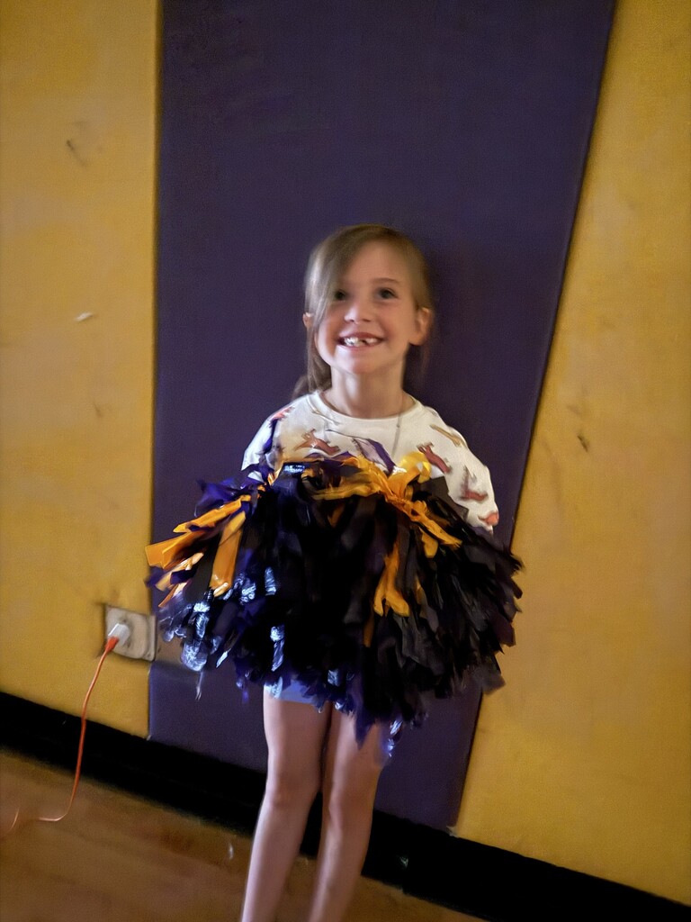 Student with pompoms.