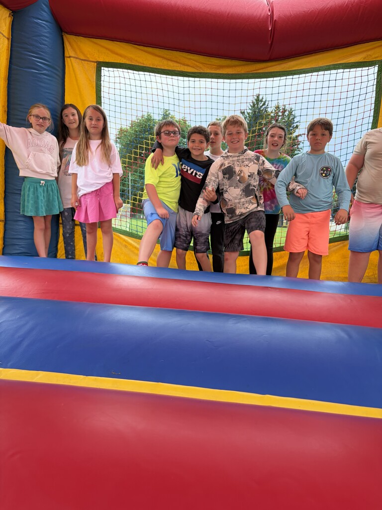 students on bounce house