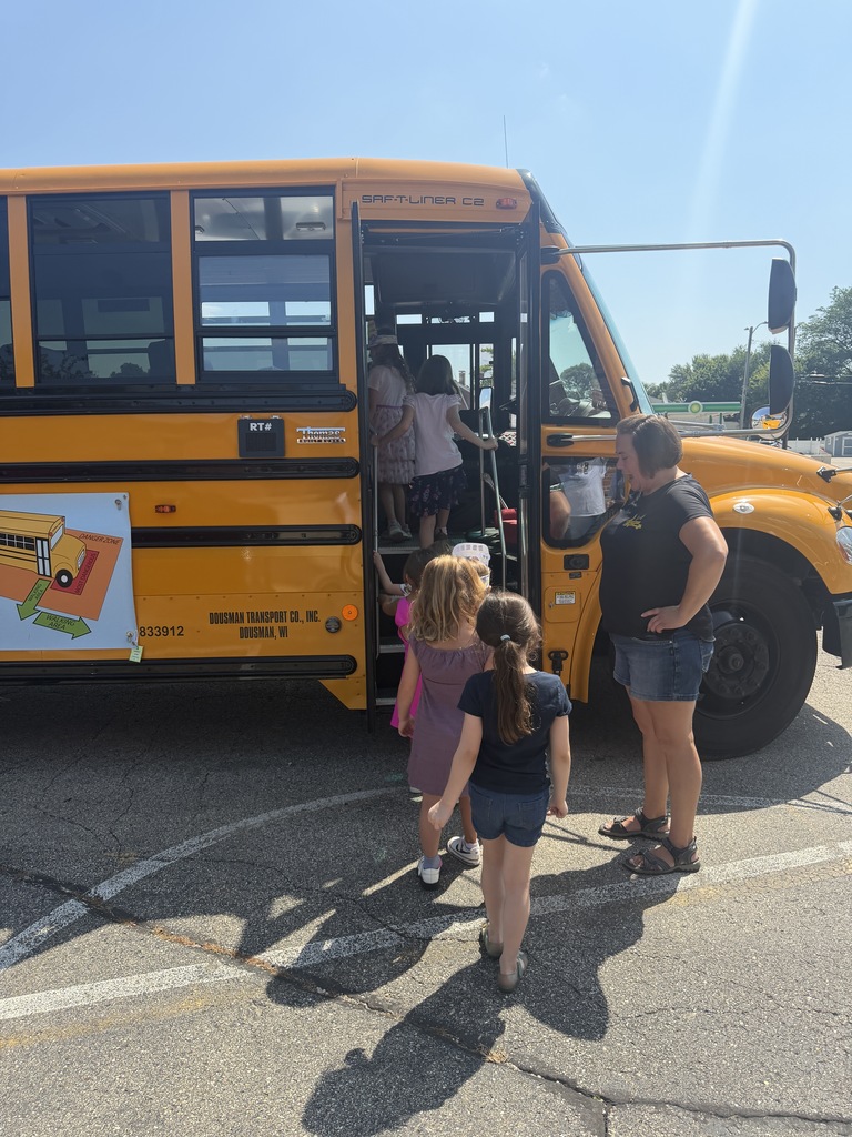 Students getting on the bus at Safety Town. 