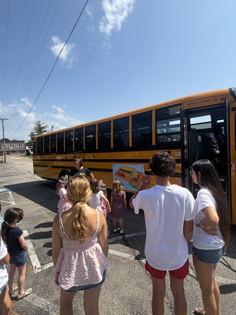 Student practice bus safety on a school bus. 