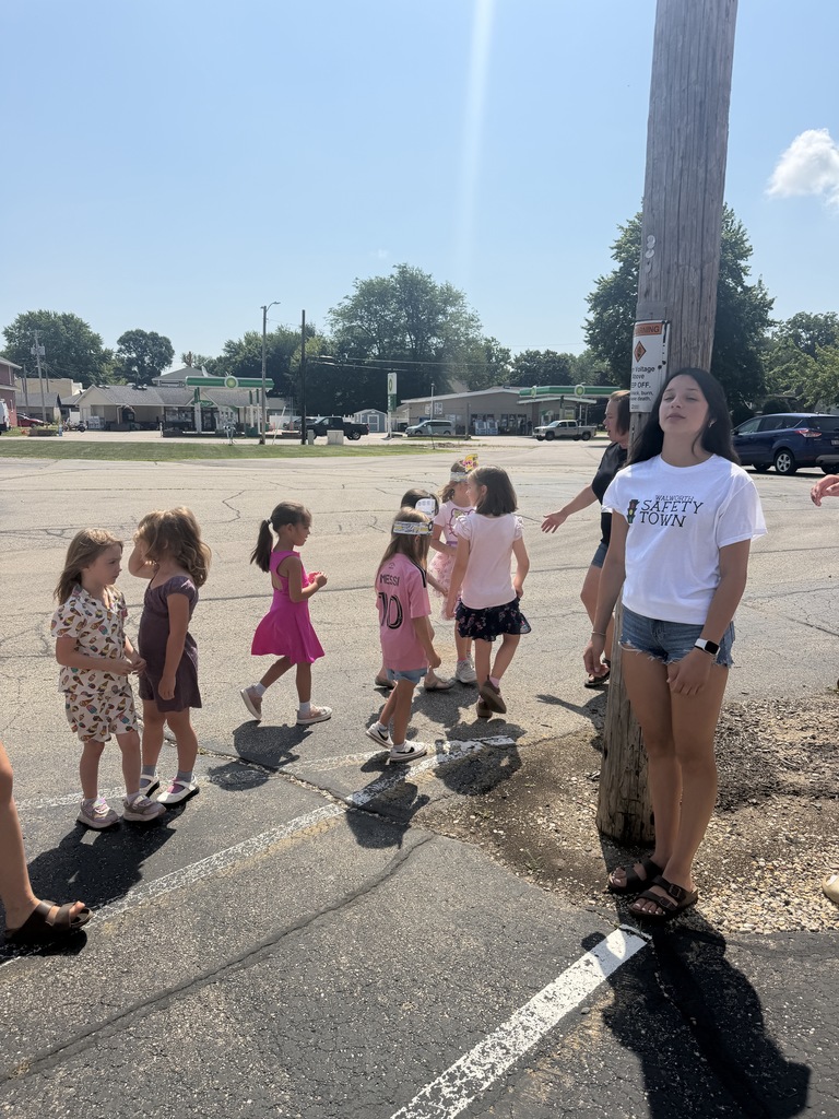 Students practicing walking on the sidewalk at Safety Town.