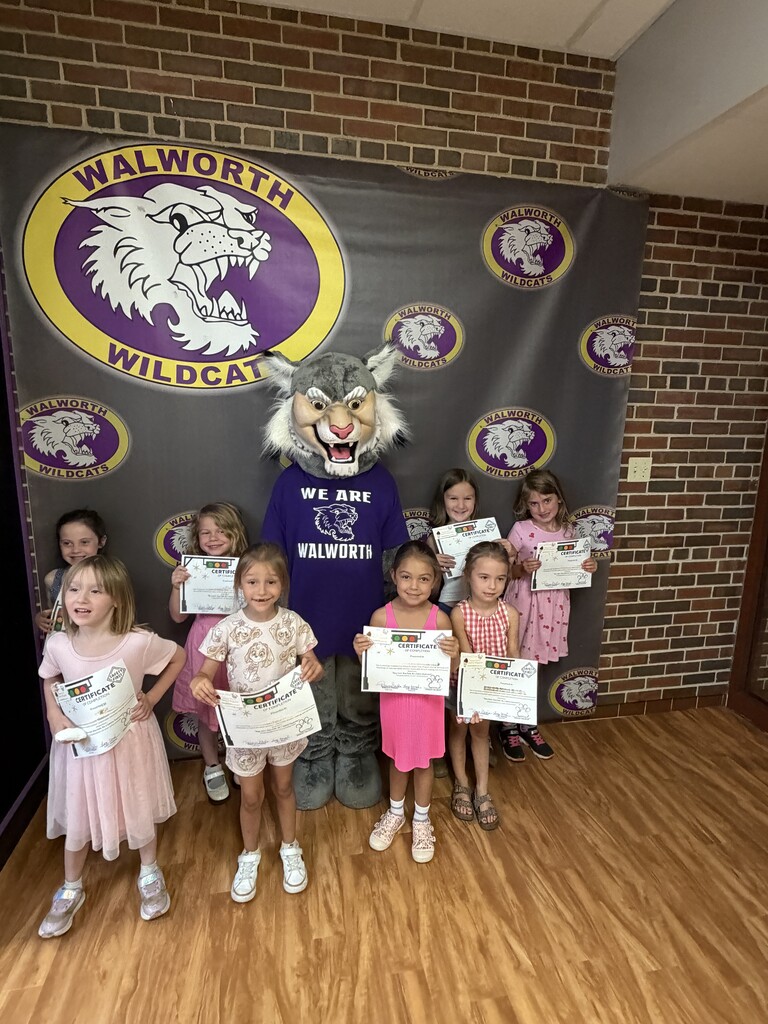 Wesley the Wildcat with students and their Safety Town certificates. 
