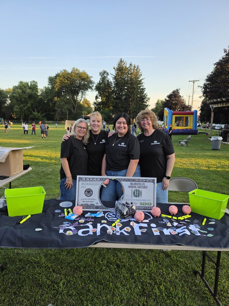 Bank First - Four adults behind a table