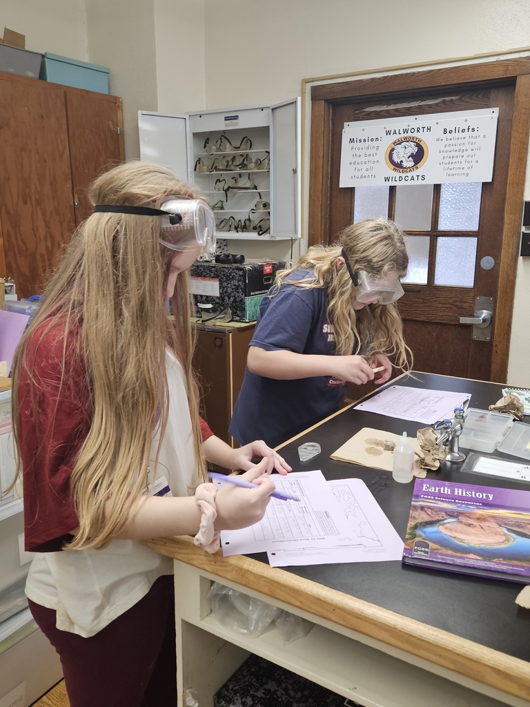 two students testing rocks