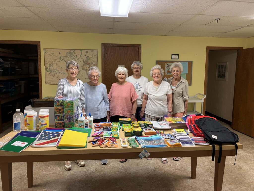women with school supplies