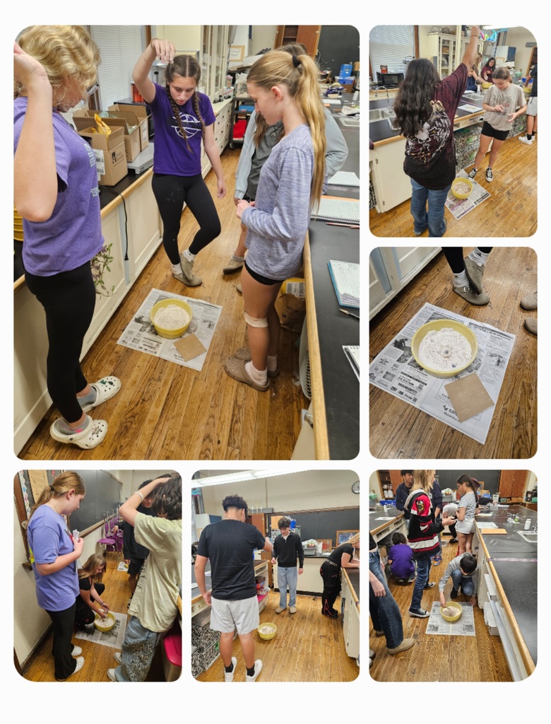 Students conducting crater experiments in 8th grade science. 