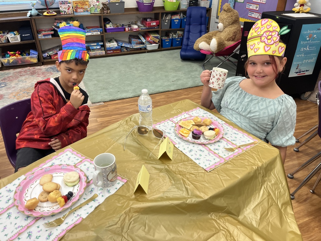students drinking tea and having snacks