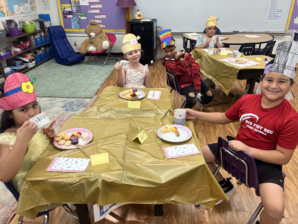 students drinking tea and having snacks