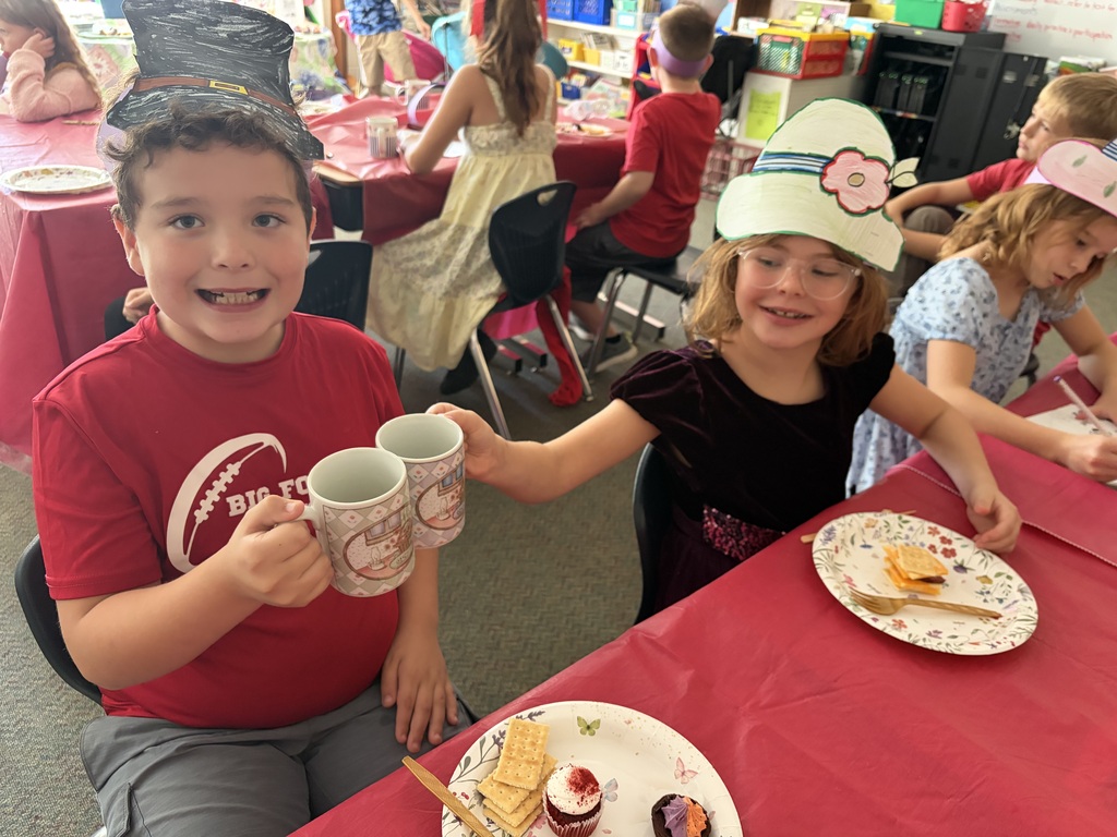 students drinking tea and having snacks