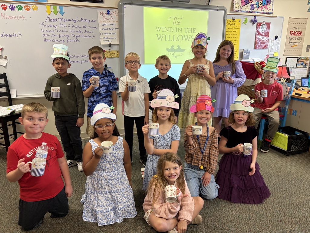 students with tea cups and party hats