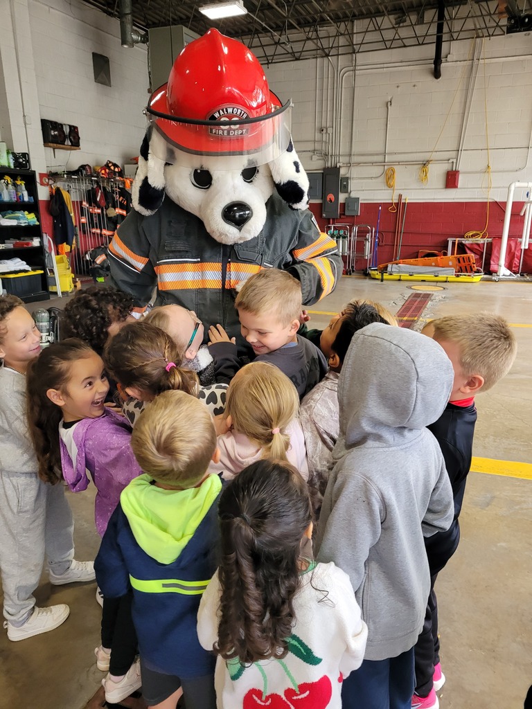 Sparky the fire dog and students.