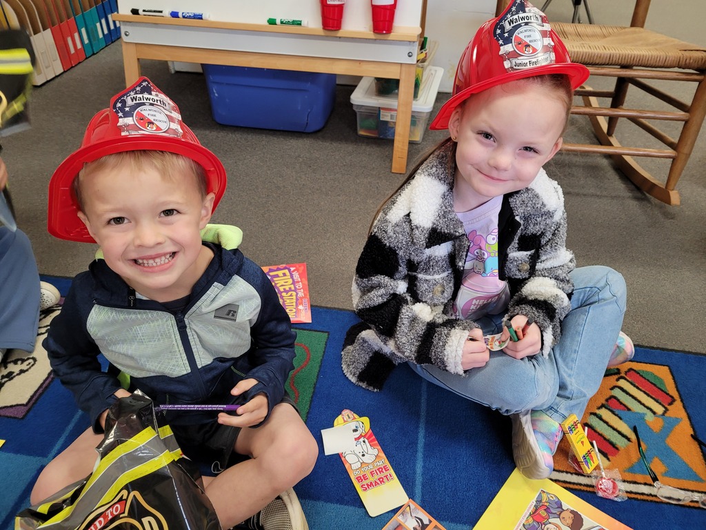 students in fireman hats