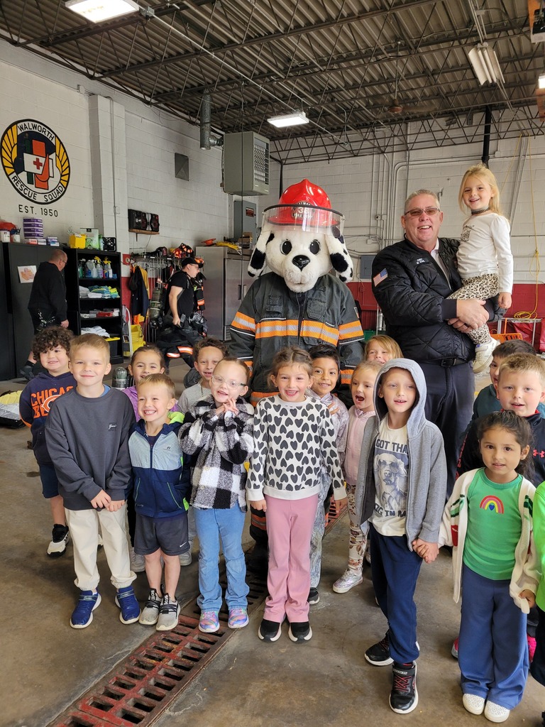 Sparky the fire dog and students.