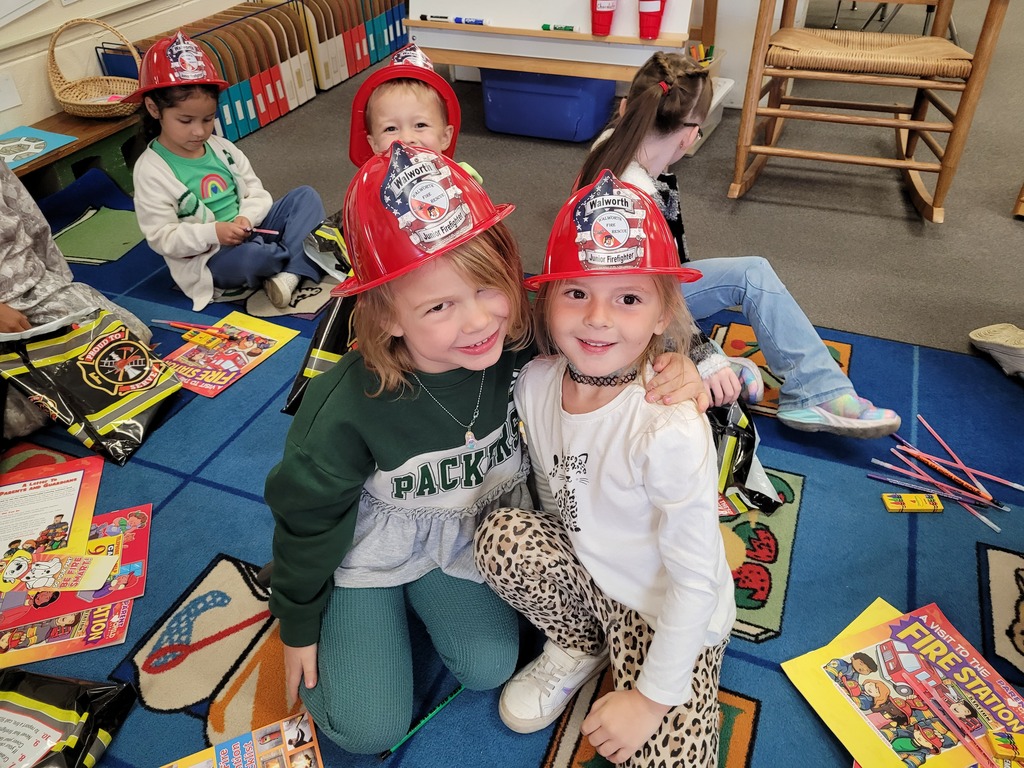 students in firemen hats