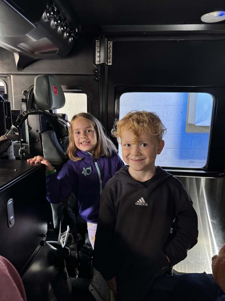 Students in a fire truck. 