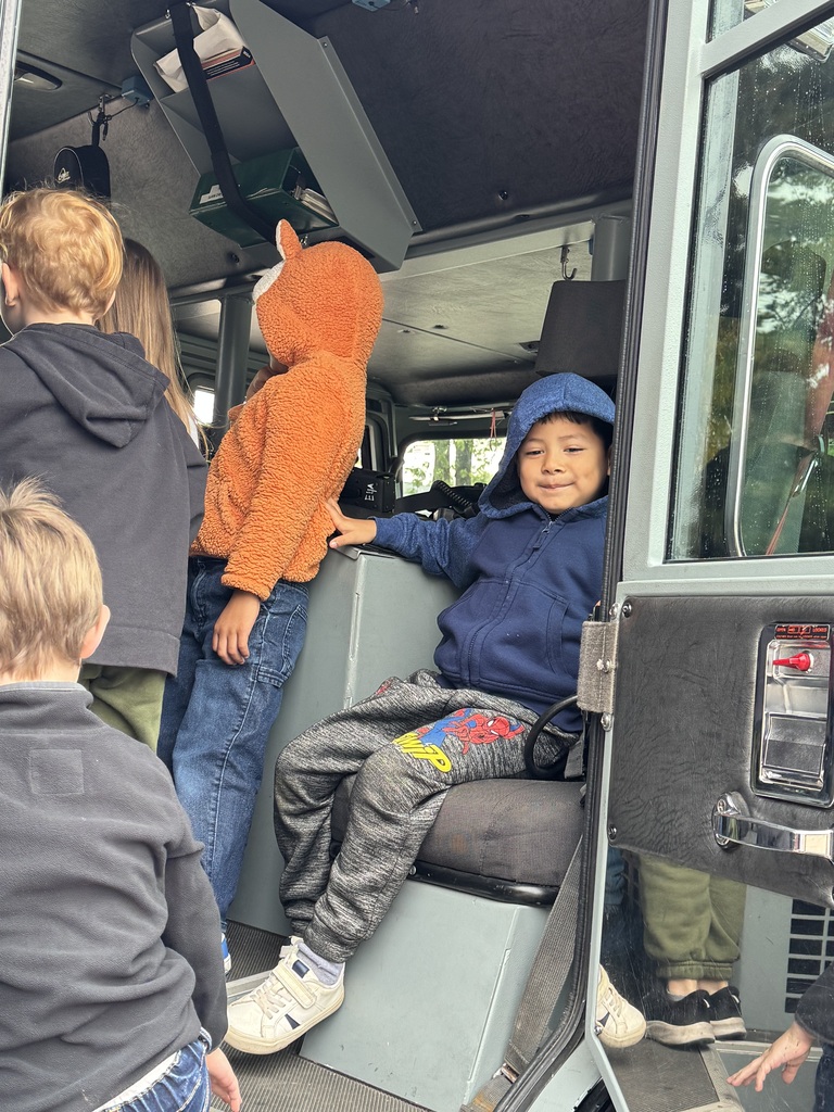 Students in a fire truck. 