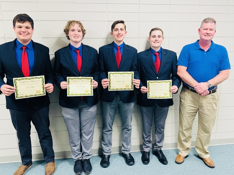 Members of the VEX robotics team with teacher Holland Brown