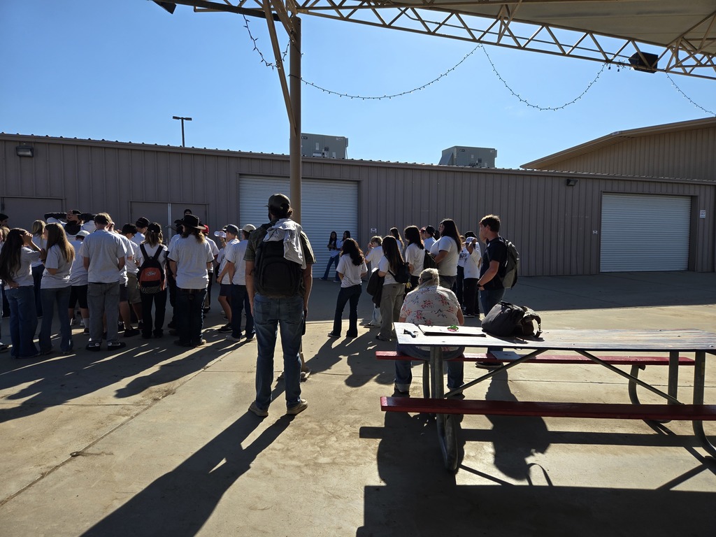 Freshmen Greenhand standing outside waiting to be let into conference.
