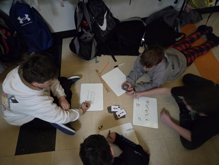 Fifth graders are learning the engineering design process and how to use Earth's resources wisely by construction their own windmills! Each group had a successful windmill able to lift a weighted bucket.